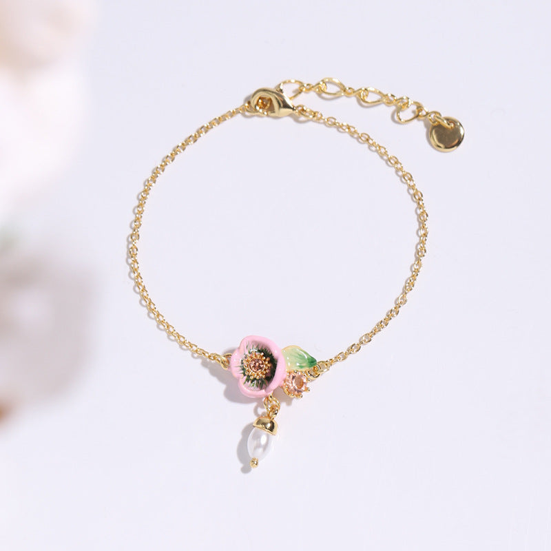 Pink flowers with pearl bracelet