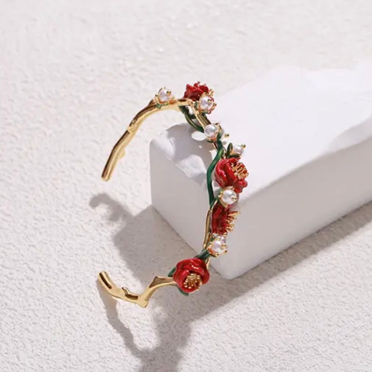 Red rose with pearl bracelet